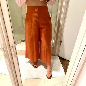 Loose orange button up pants